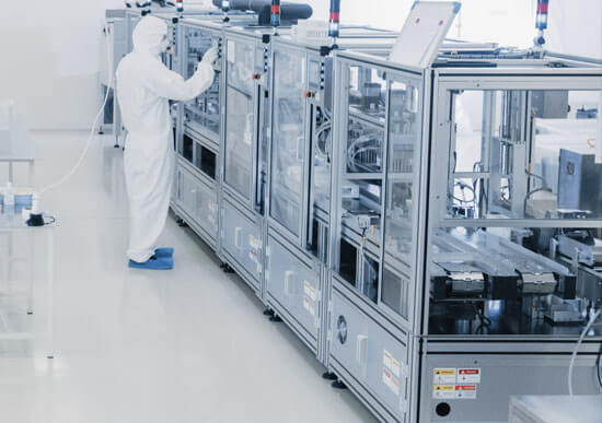 Sterile Pharmaceutical Manufacturing Laboratory where a Scientist in Protective Coverall's Do Research, Quality Control