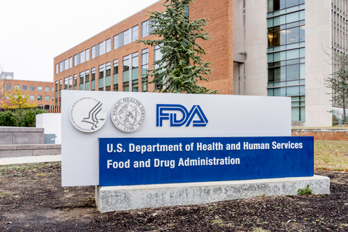 A photo of the FDA campus with the stone marquee baring the FDA logo and U.S. Department of Health and Human Services Food and Drug Administration