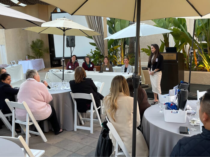 Sue Schniepp, PDA Chair, addressing the panel at an oudoor event